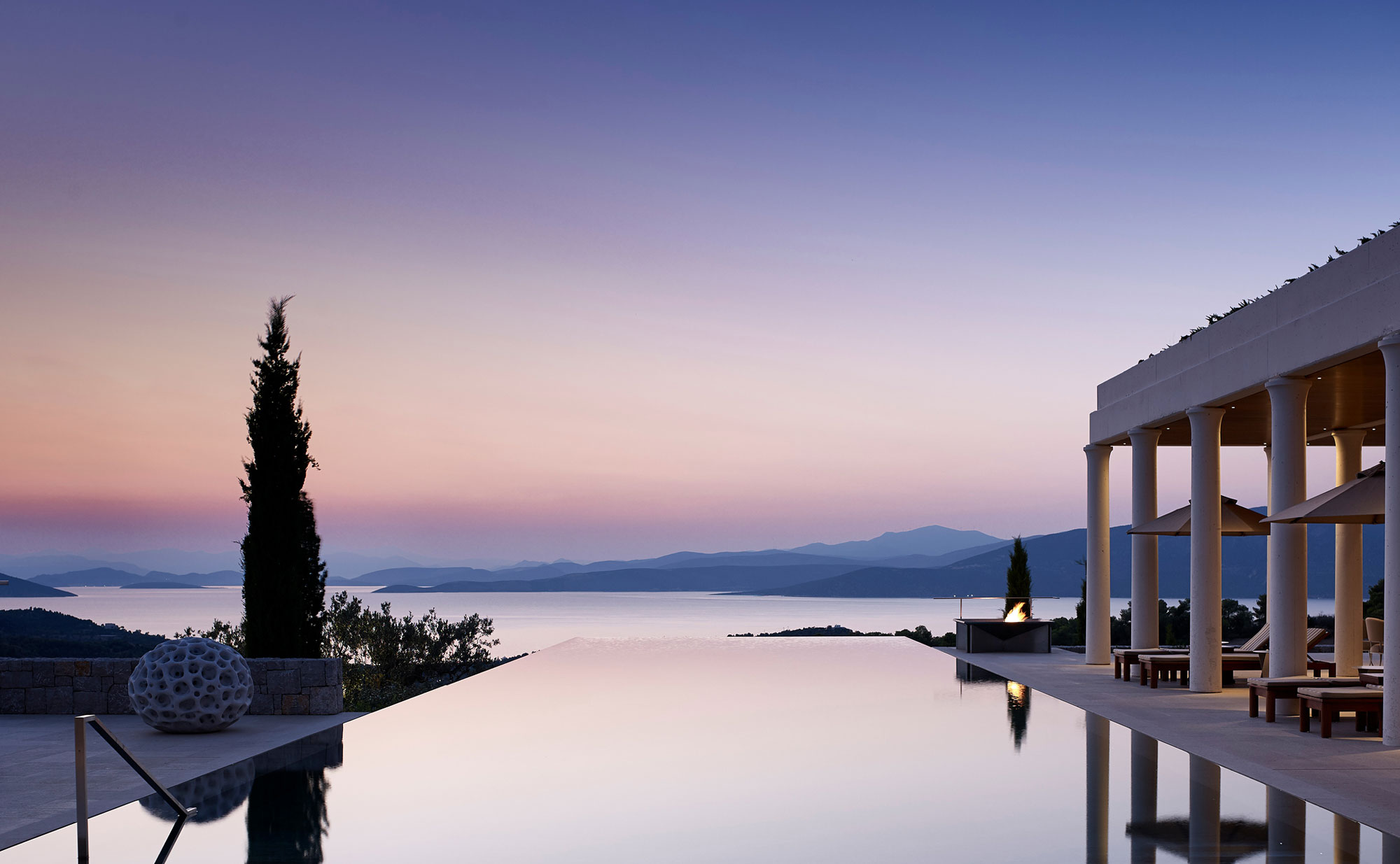 Infinity pool at sunset at Amanzoe