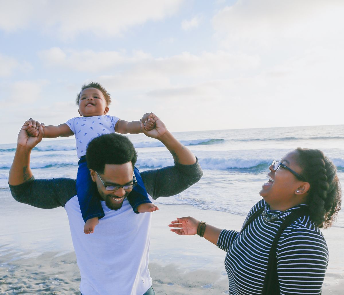 Family playing on the beach